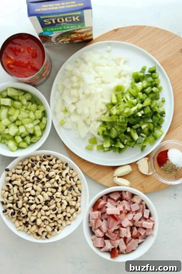Ingredients for black eyed peas dish on a board.