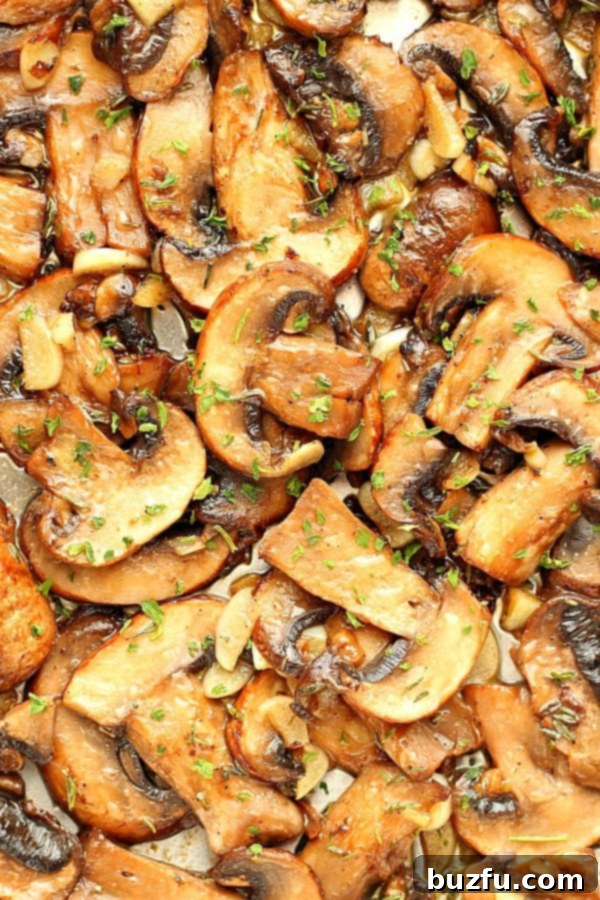 Sautéed mushrooms cooked to perfection, ready to be served from the pan, rich with garlic and butter.