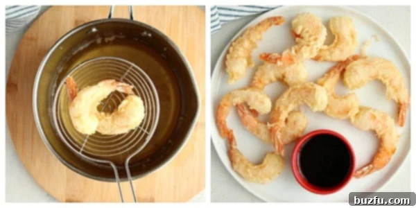 Shrimp being deep fried in hot oil.