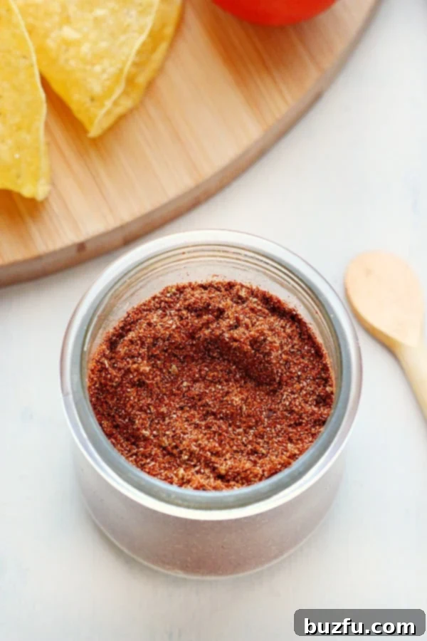 Storing Homemade Taco Seasoning A glass jar filled with homemade taco seasoning, securely lidded, emphasizing proper storage.