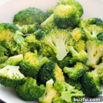 Steamed Broccoli in a white bowl.