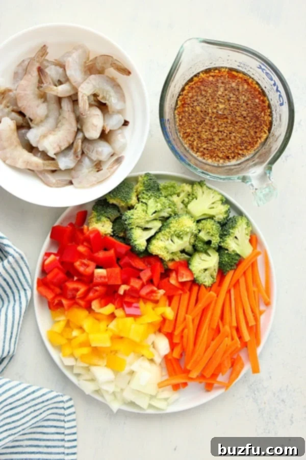 What do you need to make shrimp stir fry. Ingredients for shrimp stir fry on a white board.