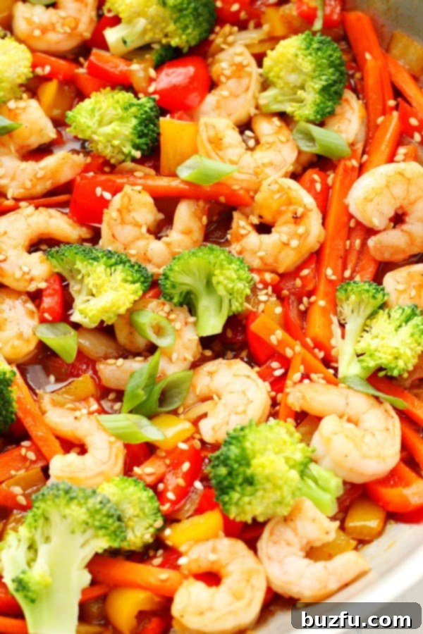 Easy Shrimp Stir Fry made with broccoli, peppers and carrots. Shrimp stir fry with broccoli.