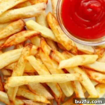 Air Fryer French fries on a plate, ready to be enjoyed.