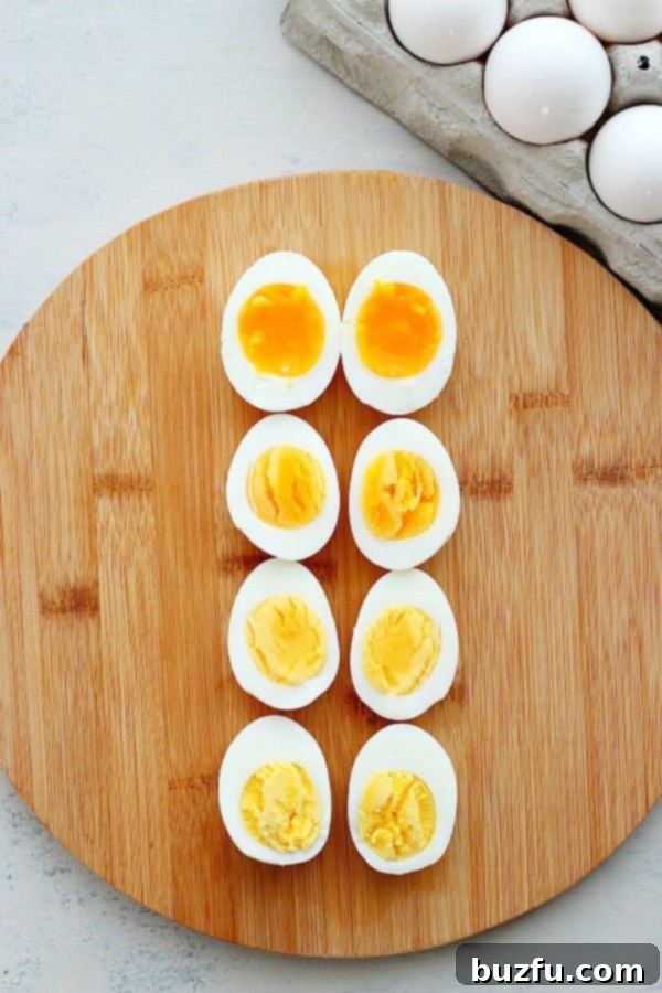 How to make perfect boiled eggs. Soft and hard-boiled eggs on a cutting board, demonstrating different doneness.