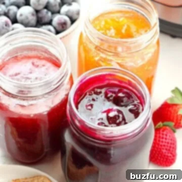 Homemade Instant Pot Jam 4 Instant Pot jam in jars, garnished with fresh fruit.