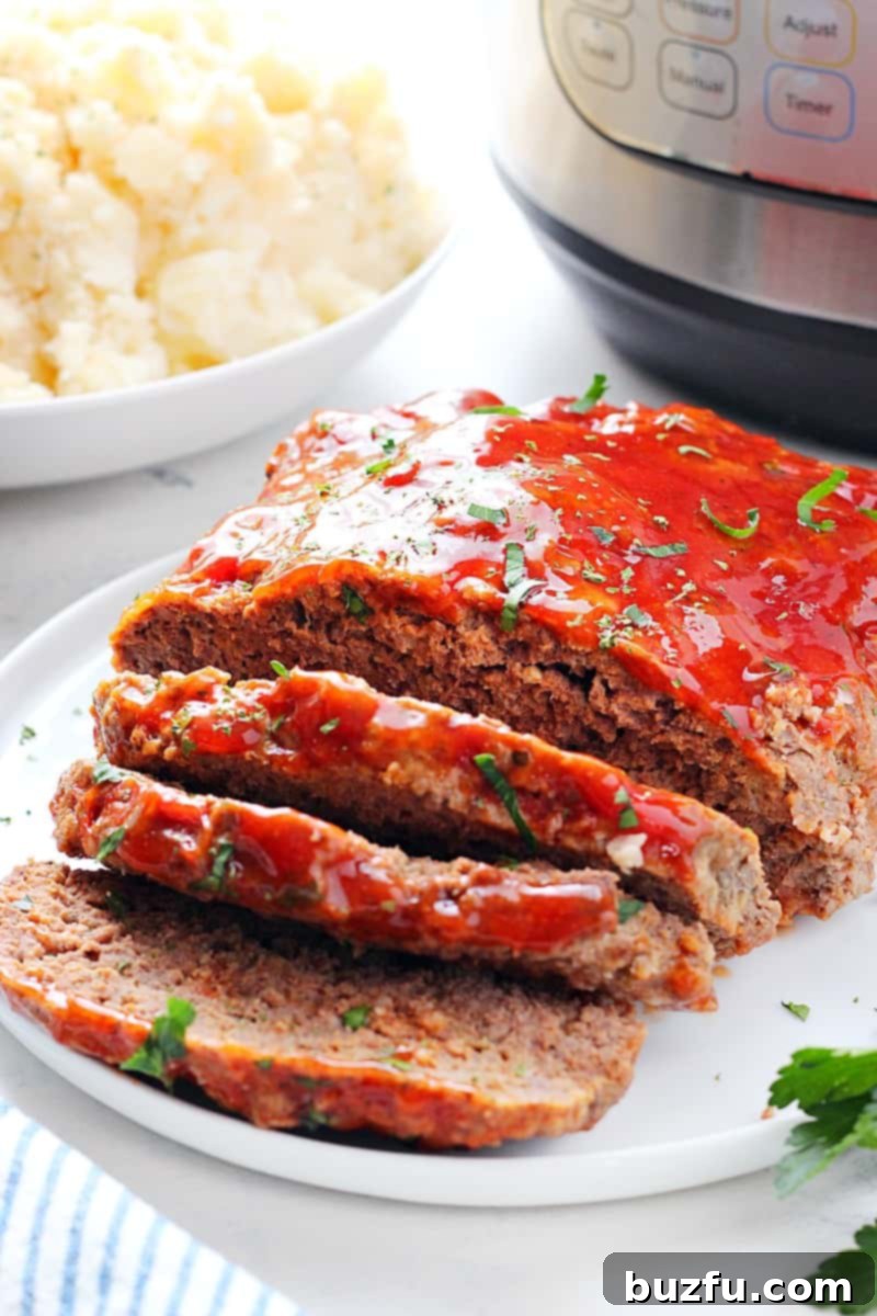 Instant Pot Meatloaf with mashed potatoes recipe. Instant Pot Meatloaf on a plate.