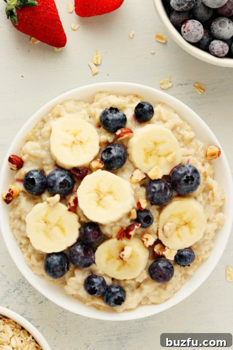 Oatmeal with berries and bananas in a bowl.