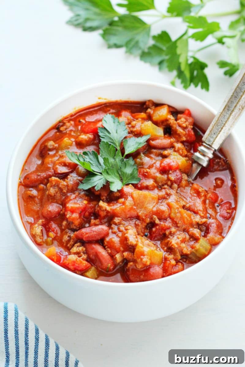 A hearty bowl of the best Instant Pot Chili, garnished and ready to be enjoyed.