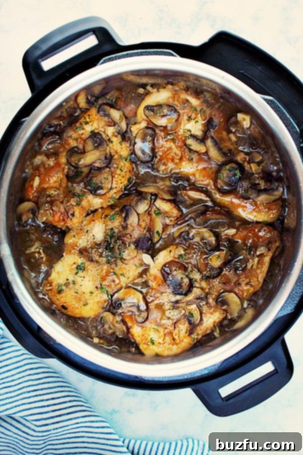 Rich Instant Pot Chicken Marsala simmering perfectly in the pressure cooker, ready to serve.
