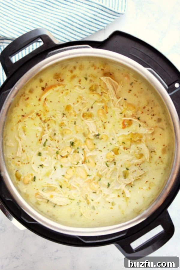 Instant Pot White Chicken Chili, creamy and inviting, served in a bowl with fresh toppings.