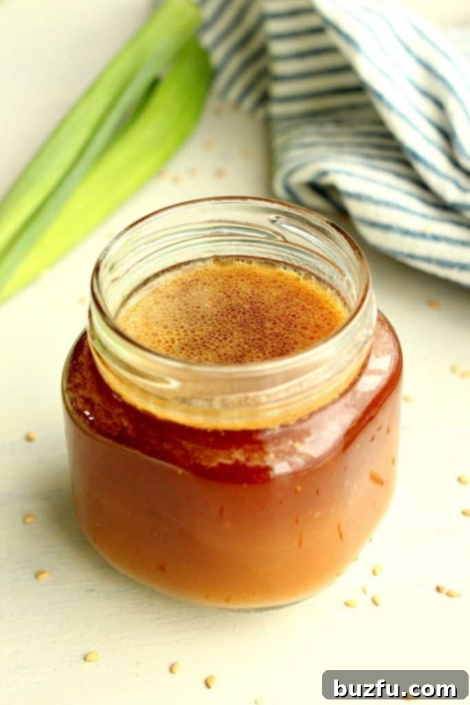 A vibrant bowl of stir fry featuring crisp vegetables, tender meat, and a rich, glossy sauce.