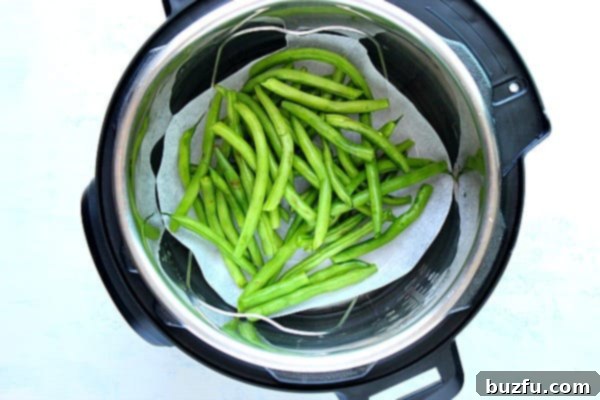 Snaps 4 A creative solution for steaming green beans without a basket: using parchment paper on a trivet inside the Instant Pot.