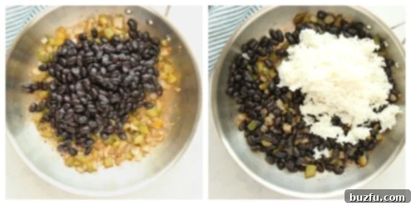Cooked black beans and rice being added to a skillet with sautéed vegetables.