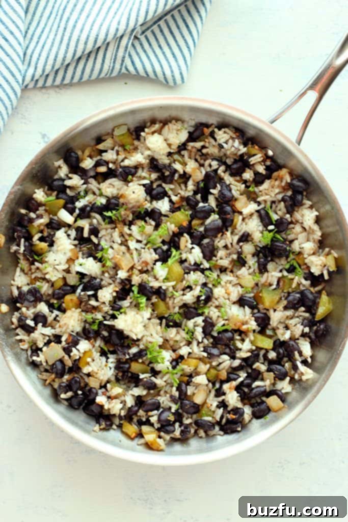Delicious Mexican Black Beans and Rice served in a rustic skillet, ready to eat.