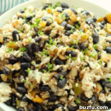 Beans with rice in a white bowl.