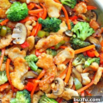 Chicken and veggies in a skillet.