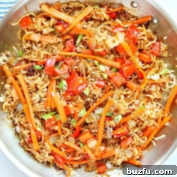 Noodles with veggies in a pan.