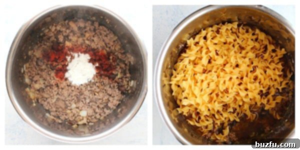 Ground beef mixture with seasoning and raw wide egg noodles layered into the Instant Pot, submerged in broth.