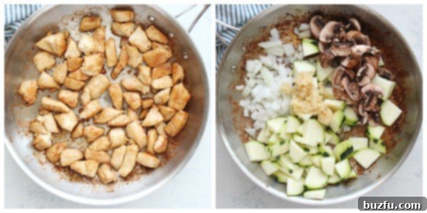 Succulent cooked chicken and vibrant sauteed vegetables sizzle together in a large pan, demonstrating the ease of this one-pan hibachi recipe.