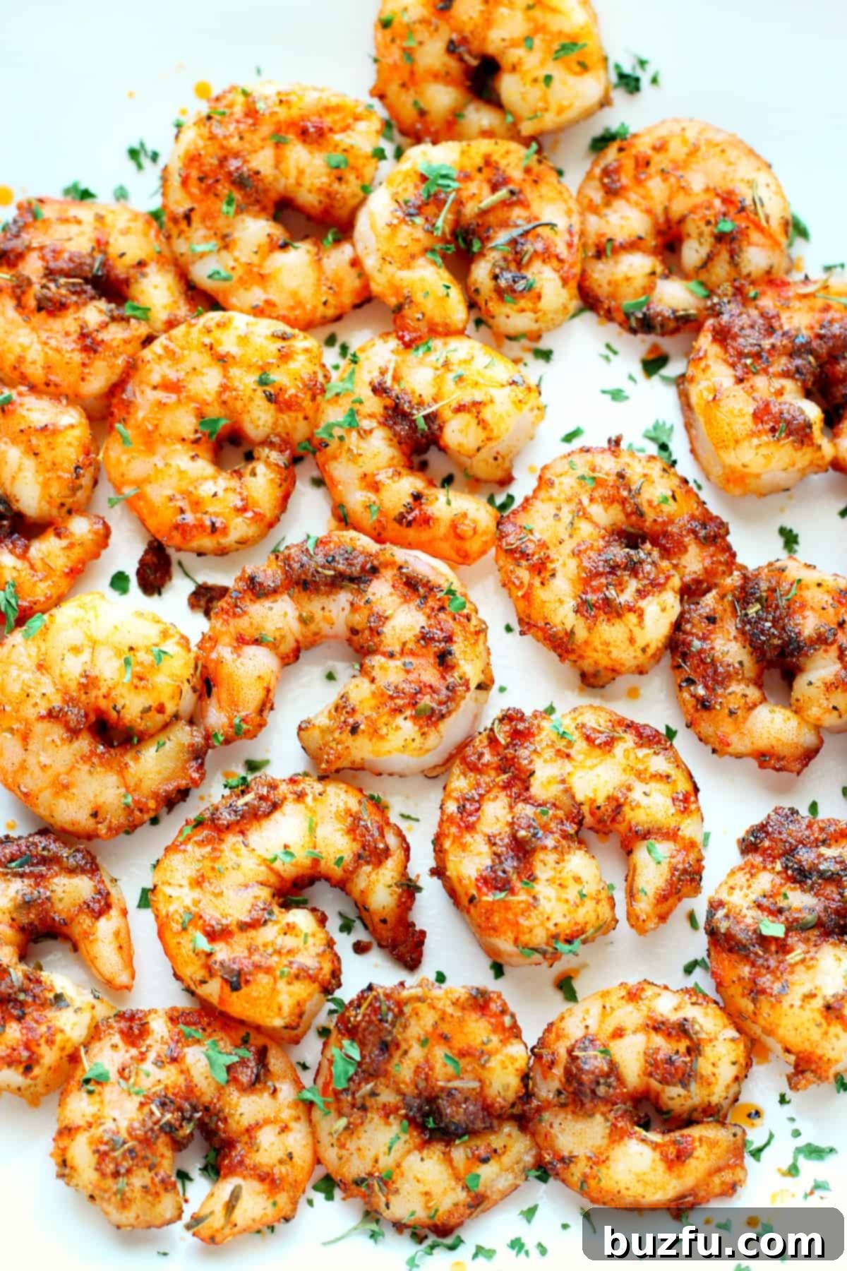 Best Air Fryer Shrimp Air fried shrimp on a plate.