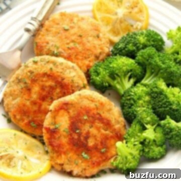 Crispy Golden Salmon Patties 3 Salmon cakes on a plate, ready to be served.