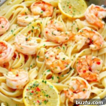 Shrimp with fettuccine in a pan.