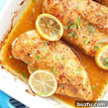Zesty Lemon Pepper Chicken 3 Limon ve tavuk fırın tepsisinde.