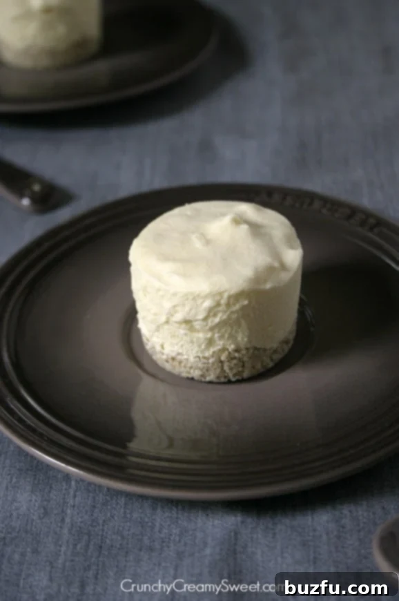 Close-up of frozen coconut dessert with white chocolate shell, ready to be enjoyed