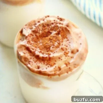 Whipped hot chocolate in a glass.