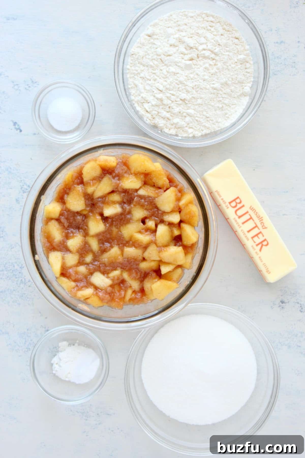 Apple Dump Cake ingredients Ingredients for cake on a white board.
