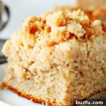 Effortless Crumble 4 Piece of crumb cake on a plate.