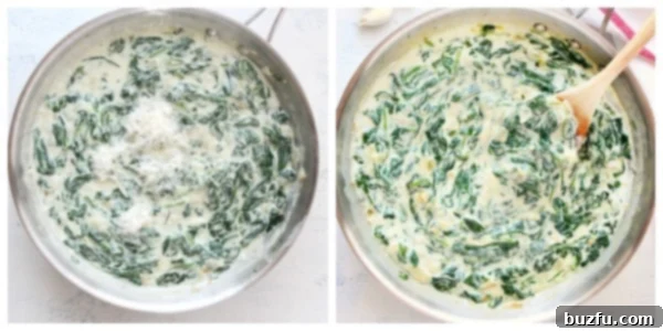 Finished creamy spinach in a skillet with melted Parmesan cheese.