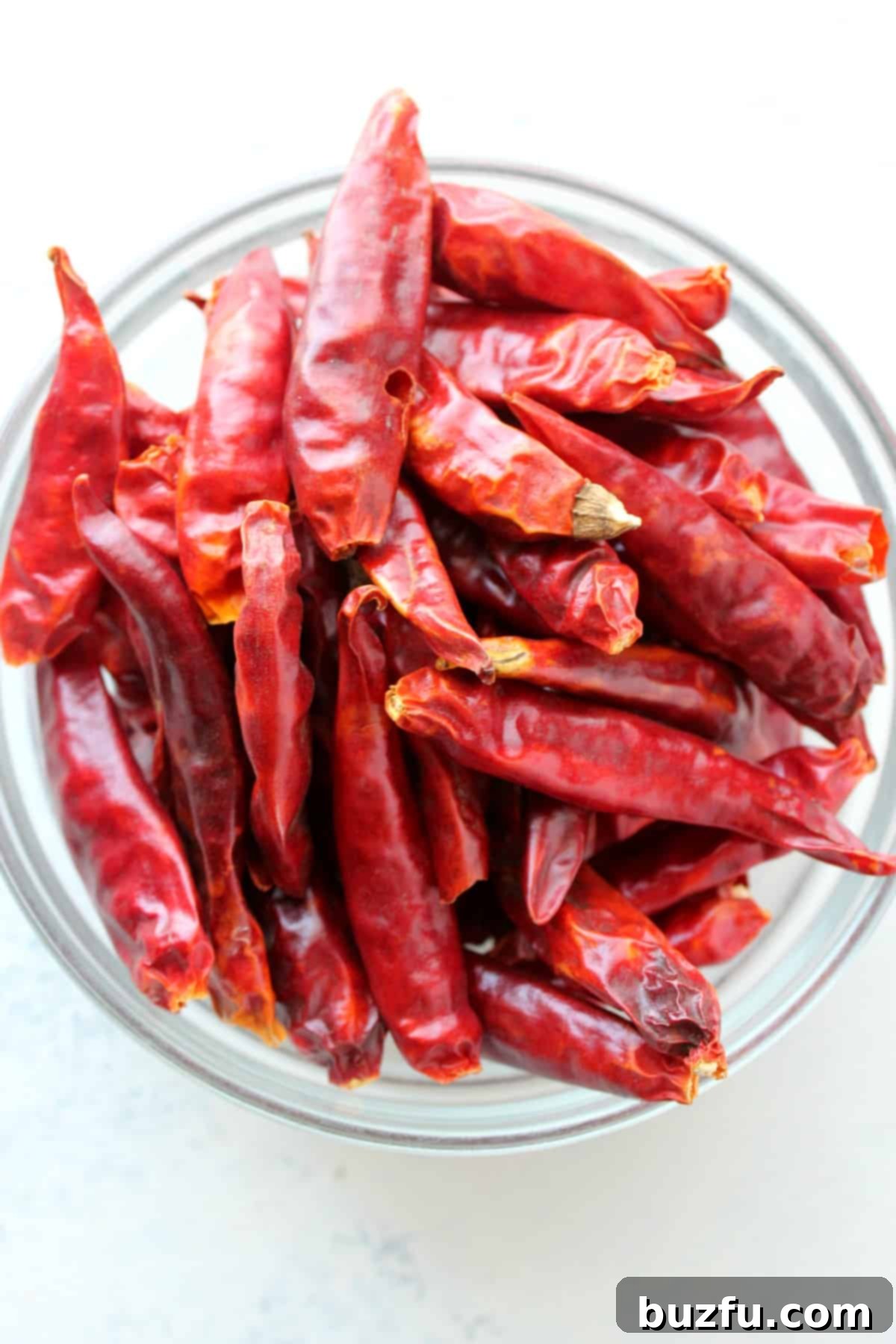 Where to find dried chili peppers for Kung Pao Chicken. Close-up of dried chili peppers in a small bowl.