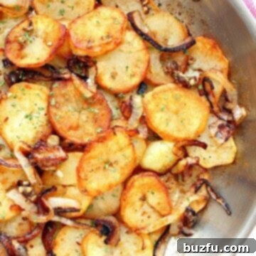 Caramelized Onion Potatoes 4 Lyonnaise Potatoes in a skillet, ready to serve.