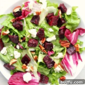 Vibrant Roasted Beet Salad 3 Salad with beets on a white plate.