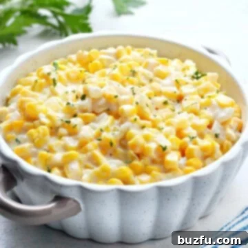 Corn in a creamy sauce in a dish.