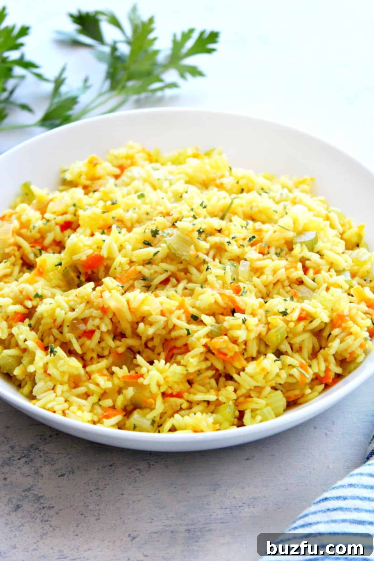 Best Rice Pilaf Recipe A perfectly cooked bowl of fluffy rice pilaf, ready to be served as a delicious side dish.