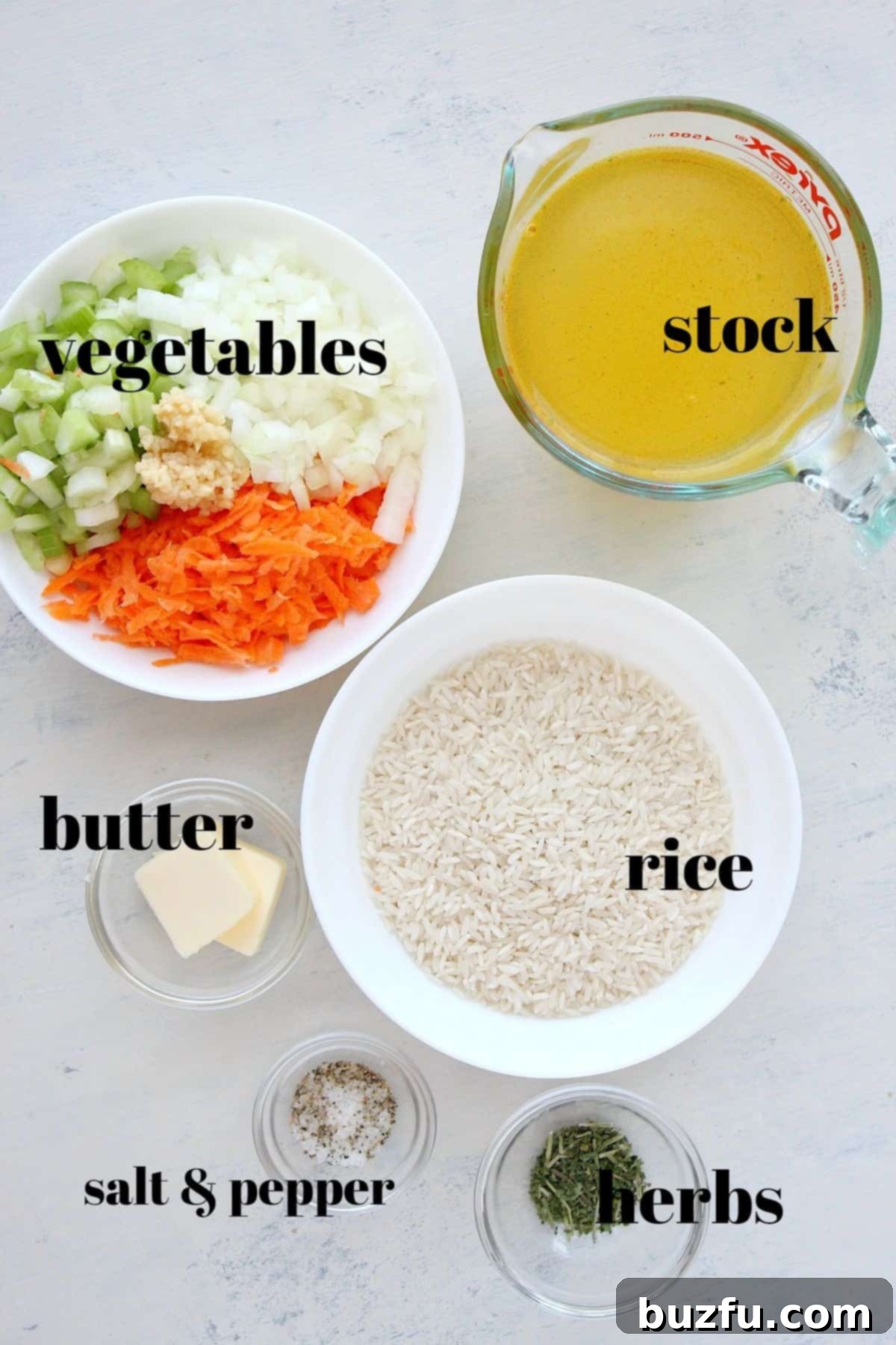 Rice Pilaf ingredients Ingredients for a delicious homemade rice pilaf laid out on a wooden cutting board.