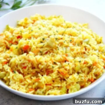 Perfect Fluffy Rice Pilaf 3 A bowl of fluffy rice pilaf, garnished and ready to be served.