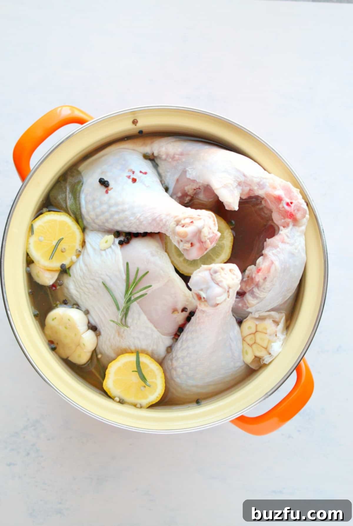 Easy Turkey Brine Recipe for Juicy Turkey Turkey in brine in a large pot, showing the process of brining for a juicy result.