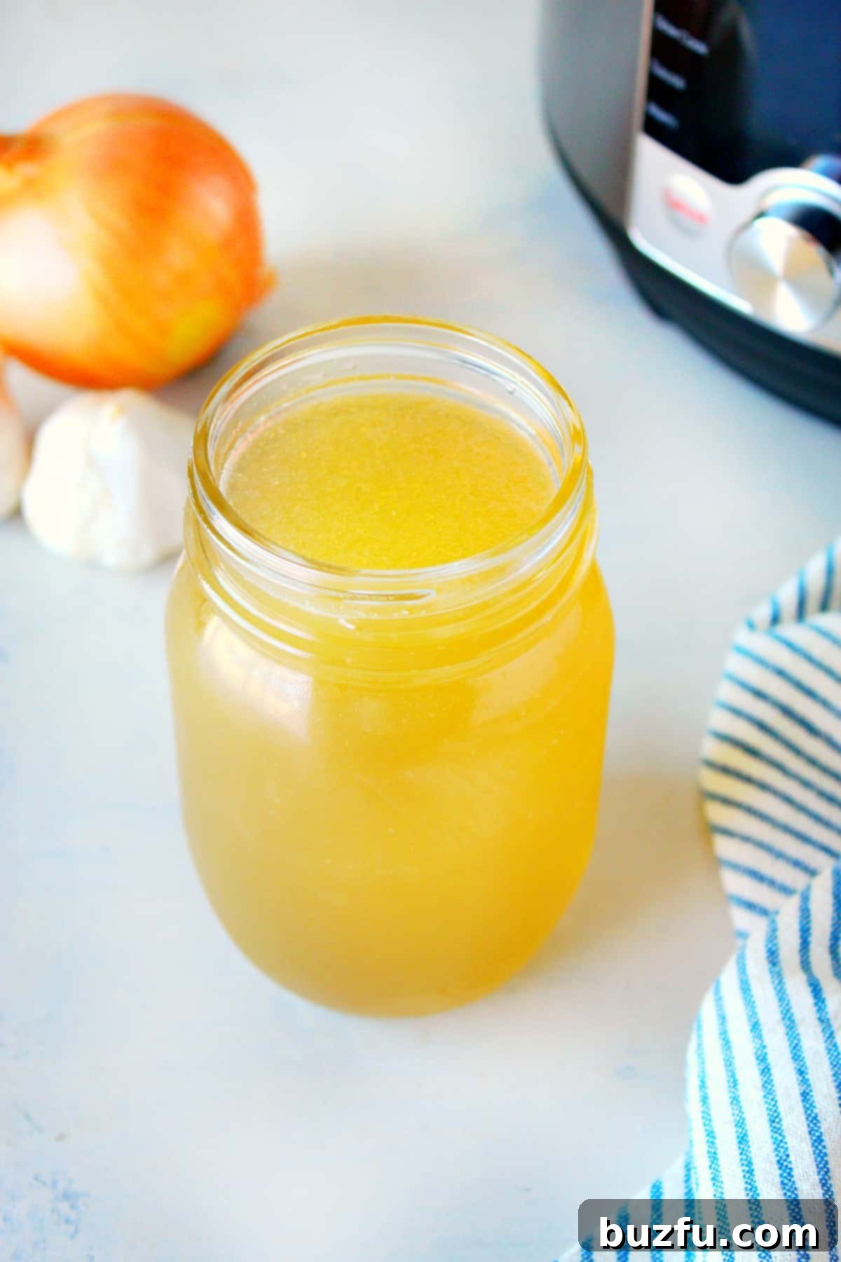 Instant Pot Turkey Stock recipe Rich, golden turkey stock in glass jars, ready for storage or use.