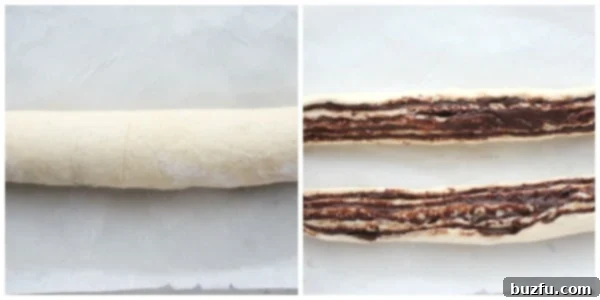 A rolled dough log, sliced lengthwise to reveal layers of chocolate, prepared for braiding.