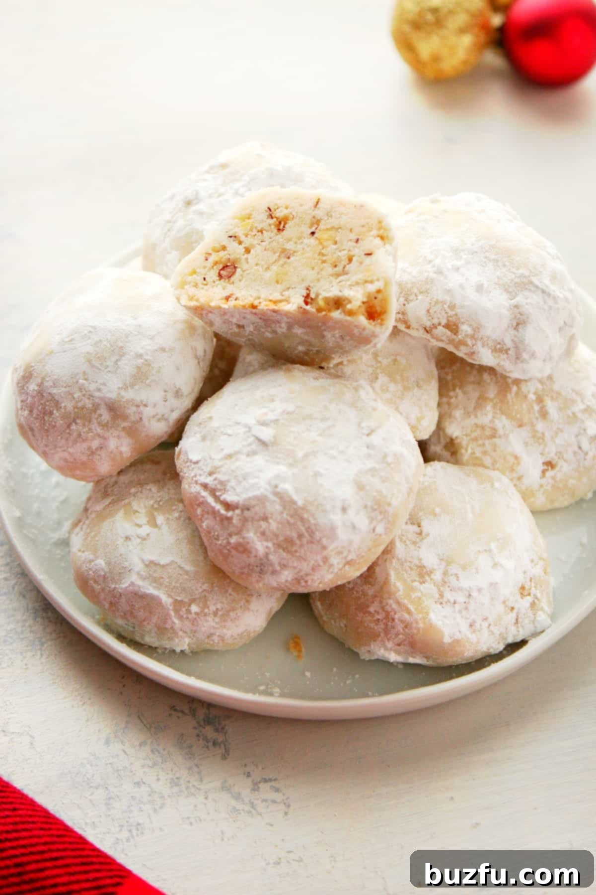 Irresistible Classic Snowball Cookies Recipe Classic Snowball Cookies beautifully arranged on a small decorative plate, ready to be served during the holidays.