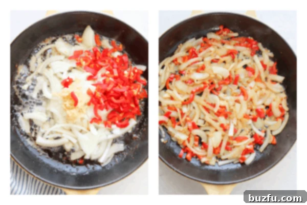 Chopped onions and red bell peppers sautéing in a skillet, becoming soft and translucent.