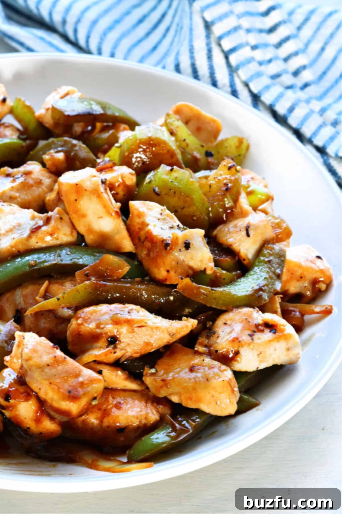 Black Pepper Chicken recipe Chicken with veggies on a plate.