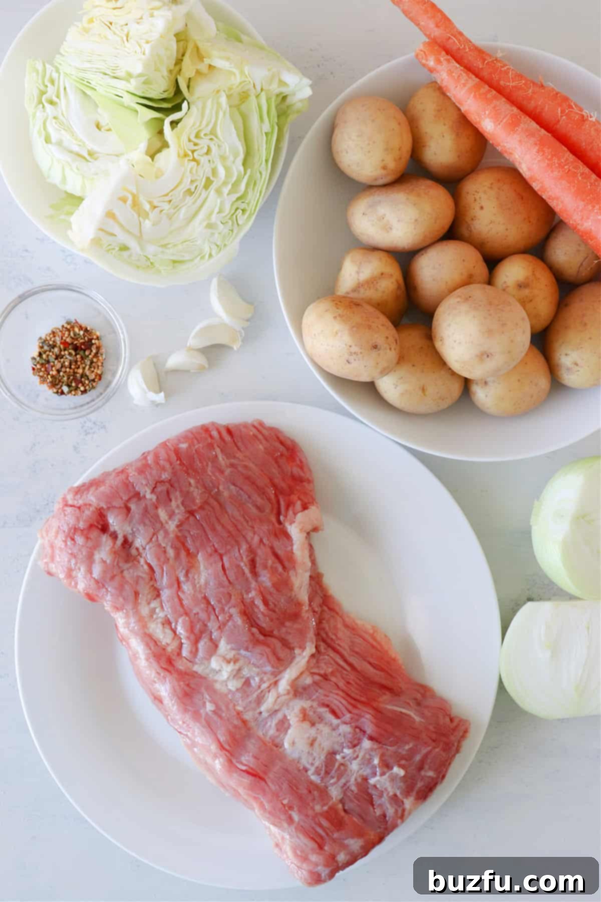 Ingredients for corned beef on a board.
