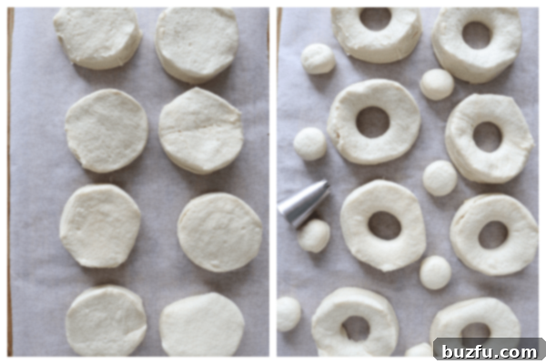 Preparing Biscuit Dough for Air Fryer Donuts Canned biscuits laid out on parchment paper, with their centers precisely cut out to form perfect donut shapes.