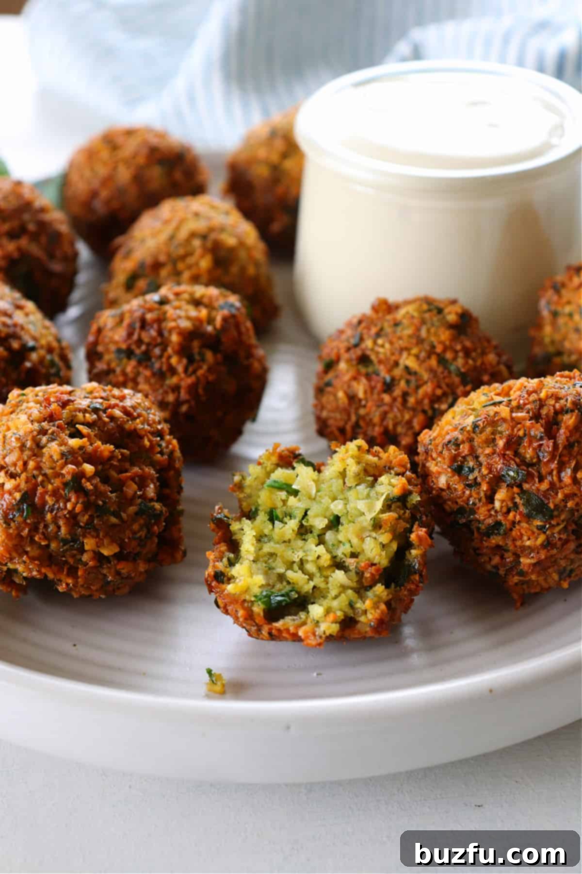 Best and easy falafel recipe. Half of falafel ball on a plate.