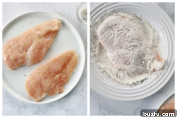Preparing and seasoning chicken for breading Two pieces of raw chicken breast, one whole and one sliced in half, next to a shallow dish of flour on a white surface, illustrating the first steps of breading.